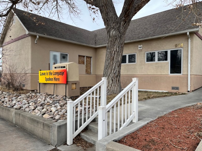 The Wellspring Health Access clinic in Casper, which is a one-story building with a sign out front that reads "Love is the language spoken here"
